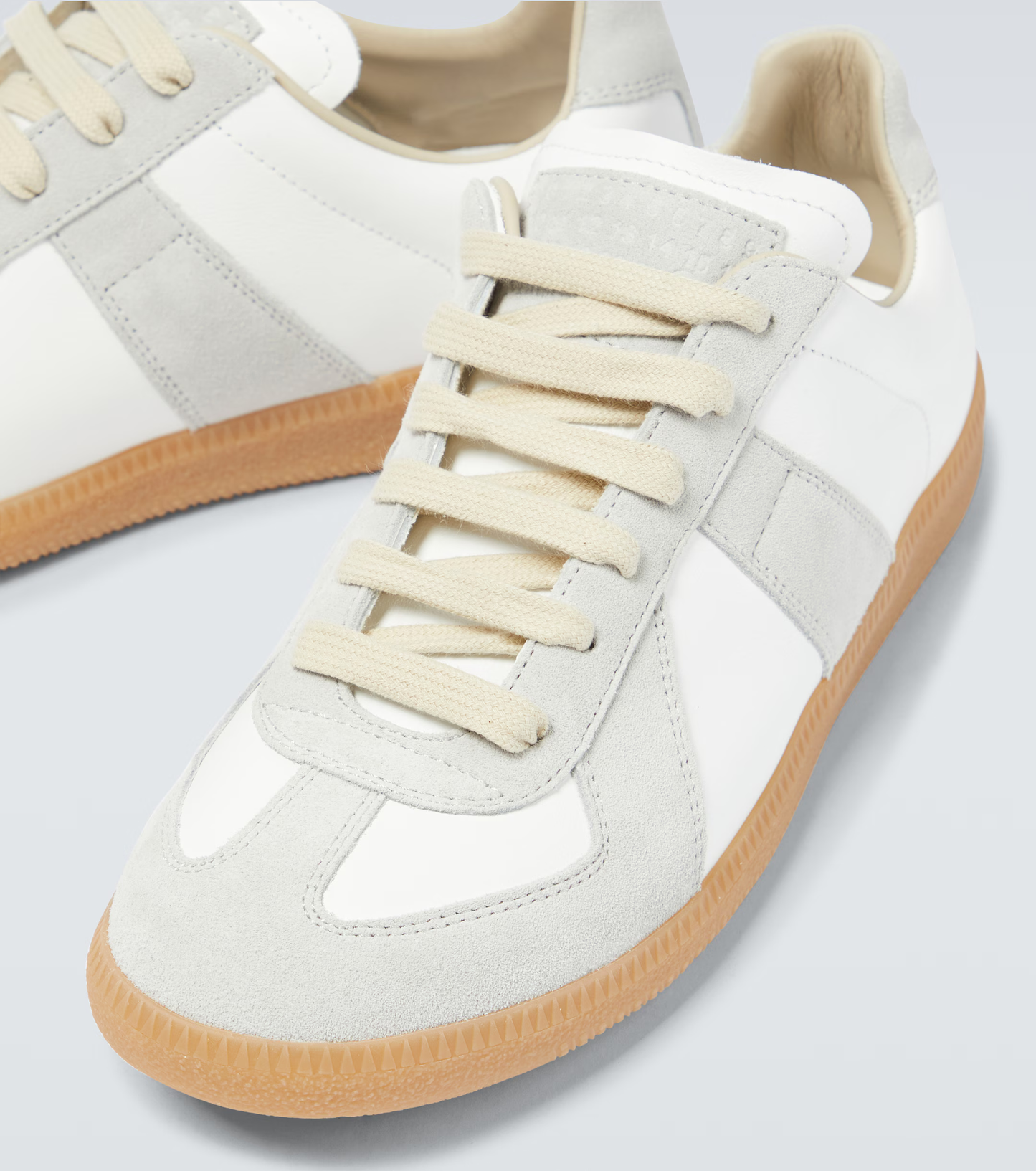 cream german army trainers sneakers
retro maison margiela style shoes
luxury suede panelled trainers
leather minimalist sneakers void packaging
