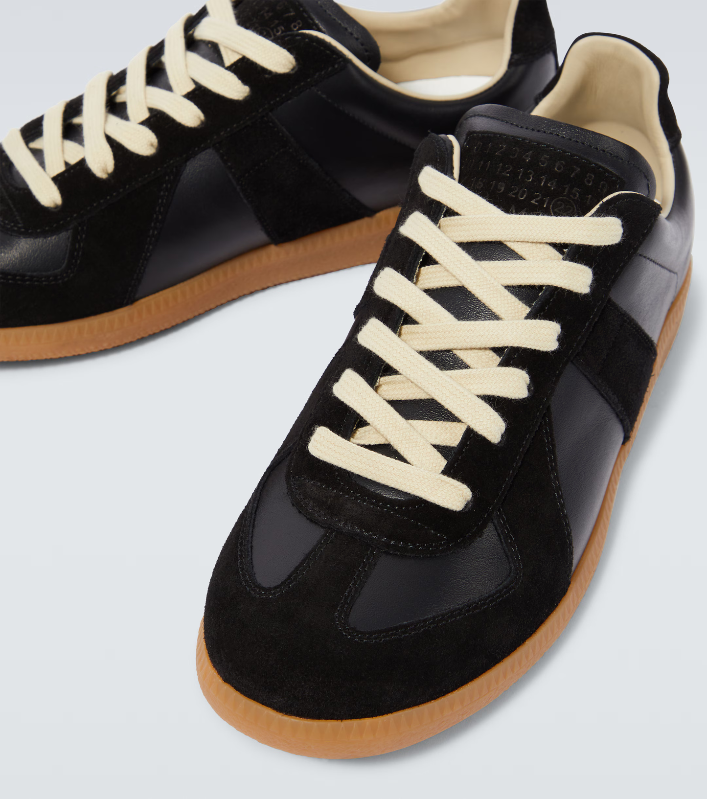 black & orange german army trainers sneakers
retro maison margiela style shoes
luxury suede panelled trainers
leather minimalist sneakers void packaging