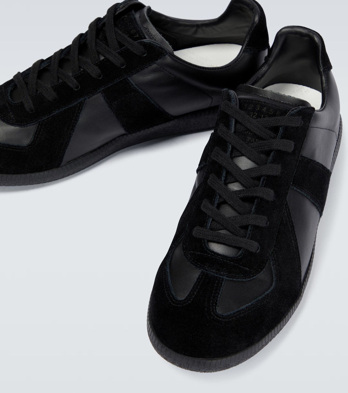 black german army trainers sneakers
retro maison margiela style shoes
luxury suede panelled trainers
leather minimalist sneakers void packaging