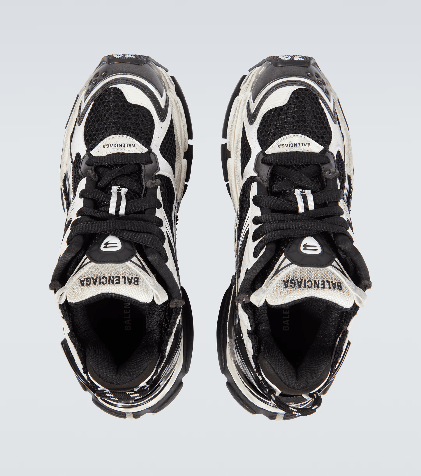 distressed white & black mesh runner sneakers
vintage luxury style running shoes
grey deconstructed street sneakers
balenciaga inspired runners