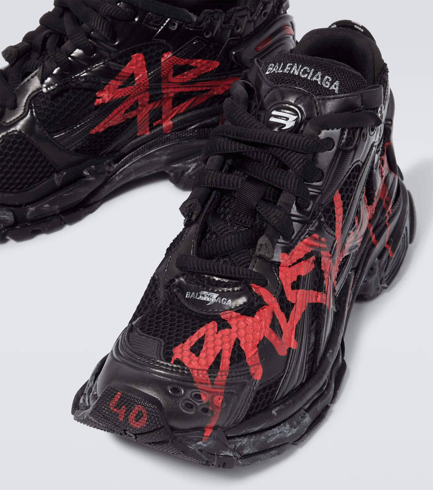 distressed black & red mesh runner sneakers
vintage luxury style running shoes
grey deconstructed street sneakers
balenciaga inspired runners