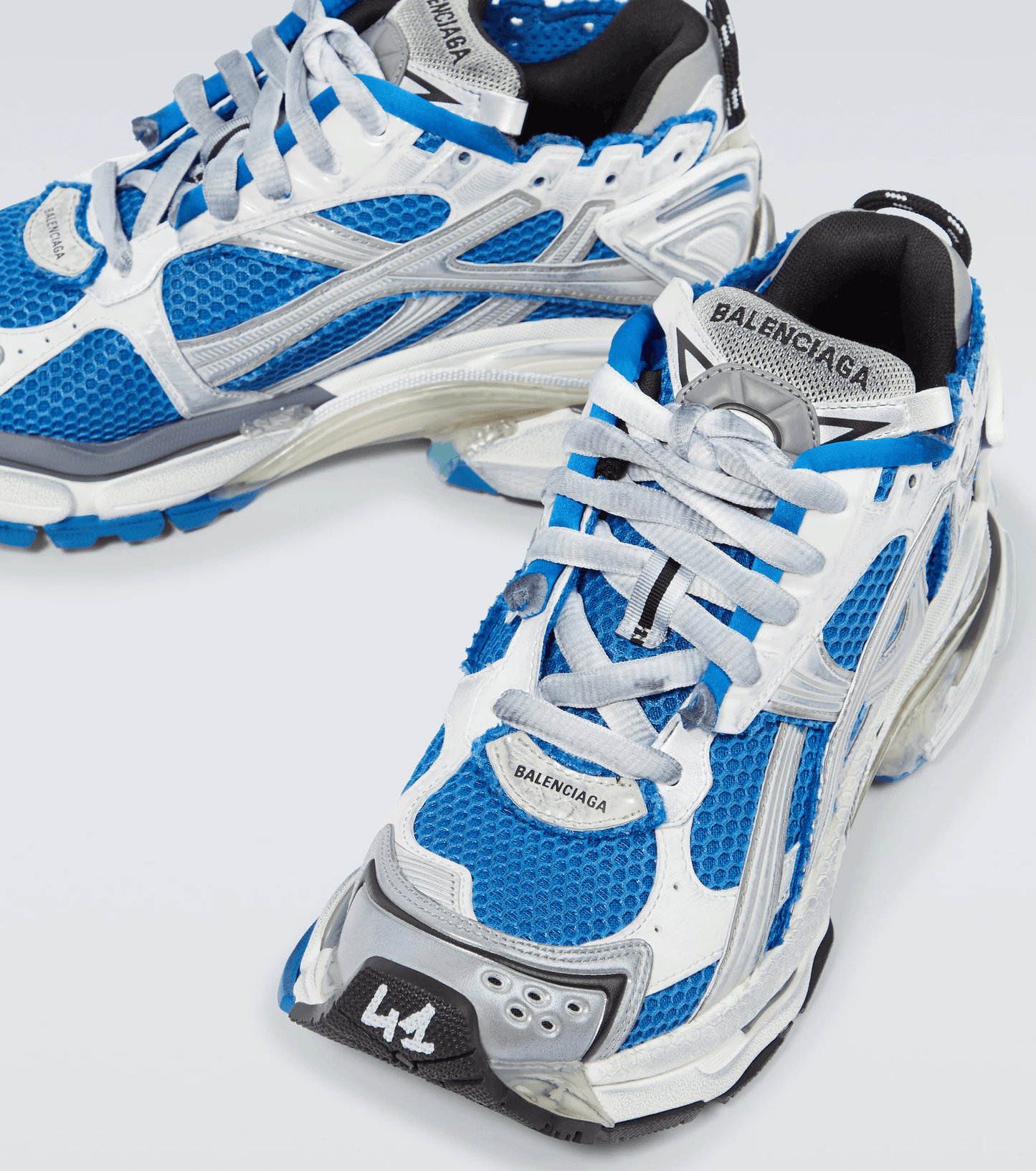 distressed white & blue mesh runner sneakers
vintage luxury style running shoes
grey deconstructed street sneakers
balenciaga inspired runners