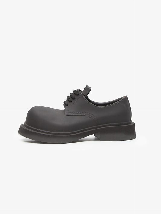 Balenciaga steroid platform derby black boots

oversized sculpted fashion shoes

chunky black runway boots

designer formal shoe alternative