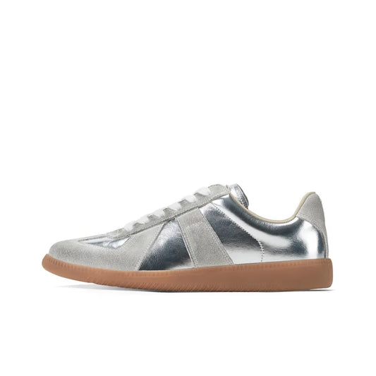 silvery german army trainers sneakers

retro maison margiela style shoes

luxury suede panelled trainers in silver

leather minimalist sneakers void packaging