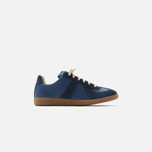 dark blue german army trainers sneakers

retro maison margiela style shoes

luxury suede panelled trainers

leather minimalist sneakers void packaging