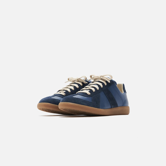 dark blue german army trainers sneakers

retro maison margiela style shoes

luxury suede panelled trainers

leather minimalist sneakers void packaging
