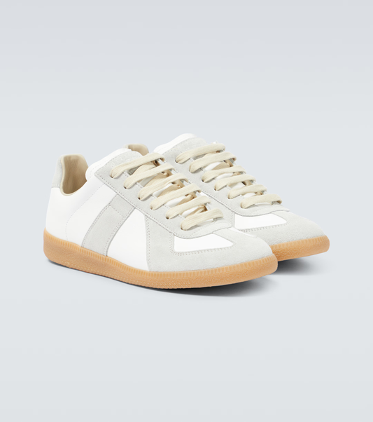 cream german army trainers sneakers

retro maison margiela style shoes

luxury suede panelled trainers

leather minimalist sneakers void packaging