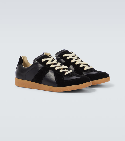 black & orange german army trainers sneakers

retro maison margiela style shoes

luxury suede panelled trainers

leather minimalist sneakers void packaging