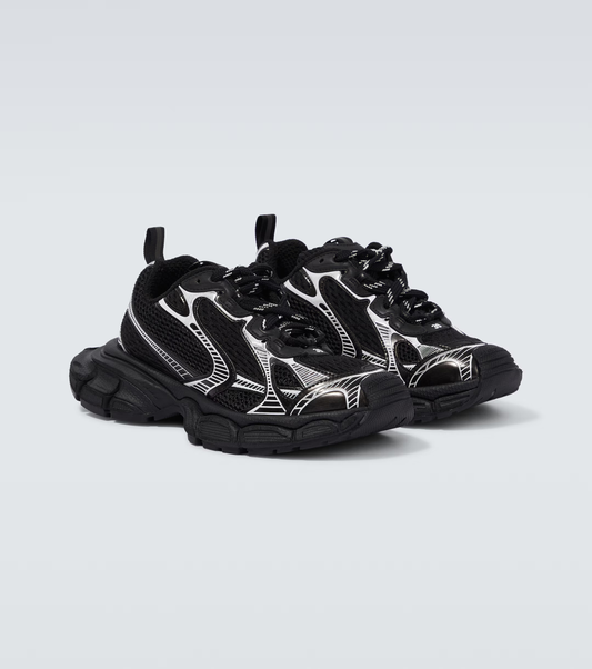 black & white 3XL oversized sneakers

chunky brutalist sneakers with mesh upper

trail running inspired tech footwear

balenciaga style extra large sneakers