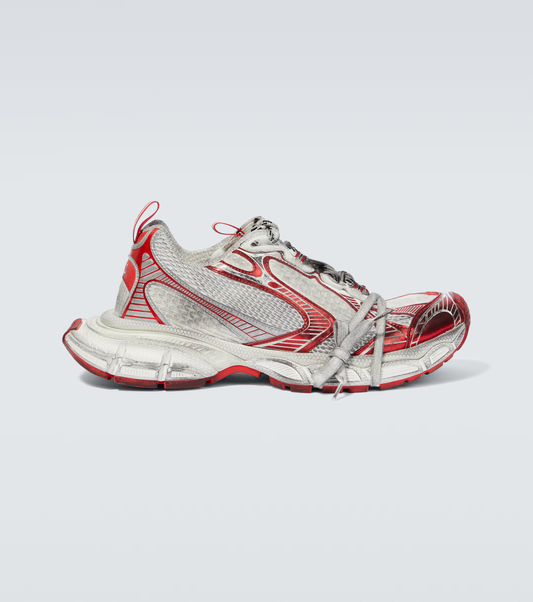 white & red 3XL oversized sneakers

chunky brutalist sneakers with mesh upper

trail running inspired tech footwear

balenciaga style extra large sneakers