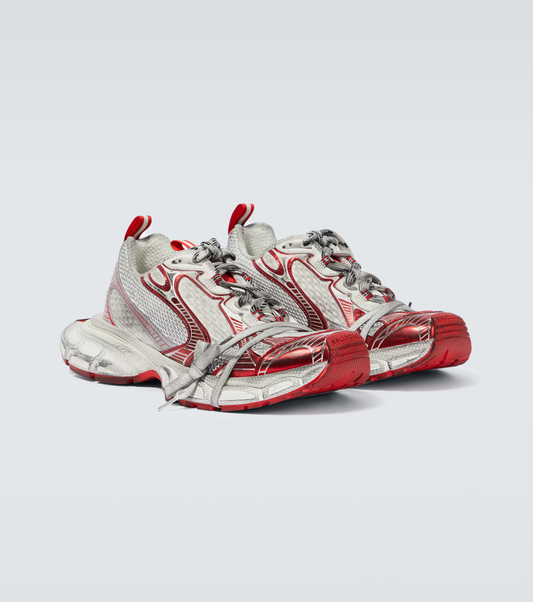 white & red 3XL oversized sneakers

chunky brutalist sneakers with mesh upper

trail running inspired tech footwear

balenciaga style extra large sneakers