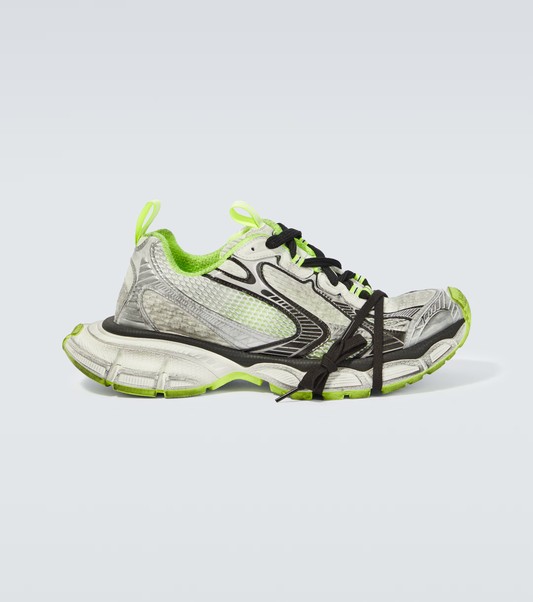white, black & green 3XL oversized sneakers

chunky brutalist sneakers with mesh upper

trail running inspired tech footwear

balenciaga style extra large sneakers