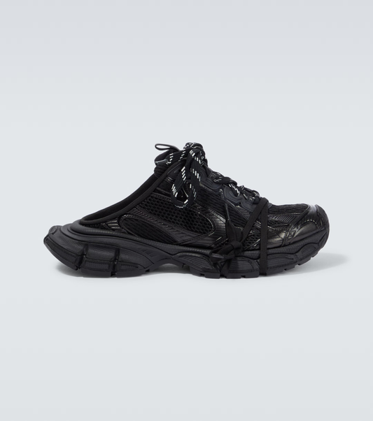 black 3XL Mule oversized sneakers

chunky brutalist sneakers with mesh upper

trail running inspired tech footwear

balenciaga style extra large sneakers
