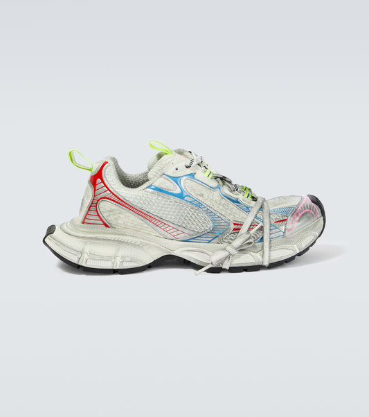 white & rainbow 3XL oversized sneakers

chunky brutalist sneakers with mesh upper

trail running inspired tech footwear

balenciaga style extra large sneakers