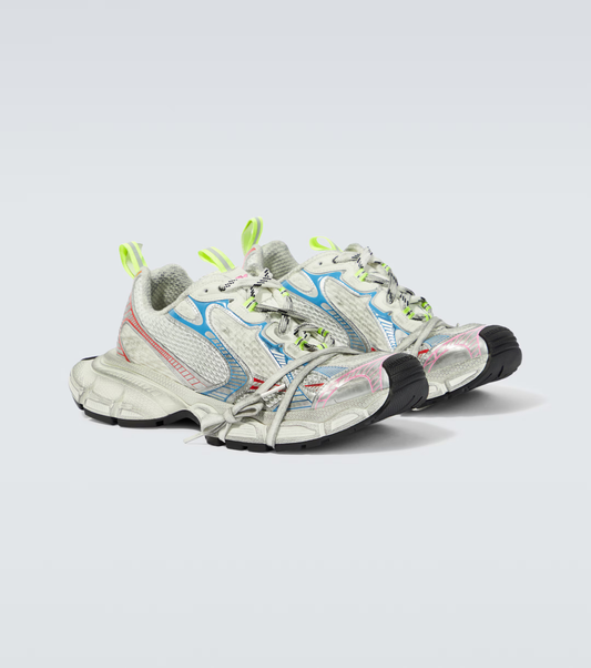 white & rainbow 3XL oversized sneakers

chunky brutalist sneakers with mesh upper

trail running inspired tech footwear

balenciaga style extra large sneakers