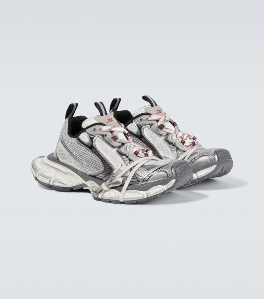 white, black & red 3XL oversized sneakers

chunky brutalist sneakers with mesh upper

trail running inspired tech footwear

balenciaga style extra large sneakers