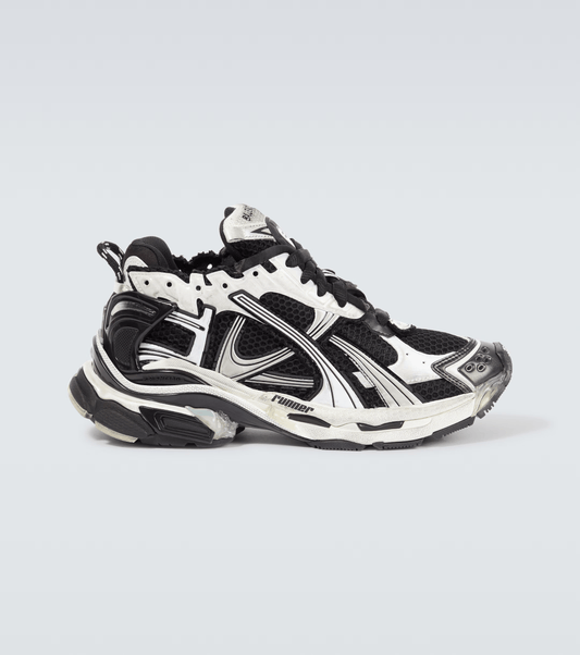 distressed white & black mesh runner sneakers

vintage luxury style running shoes

grey deconstructed street sneakers

balenciaga inspired runners