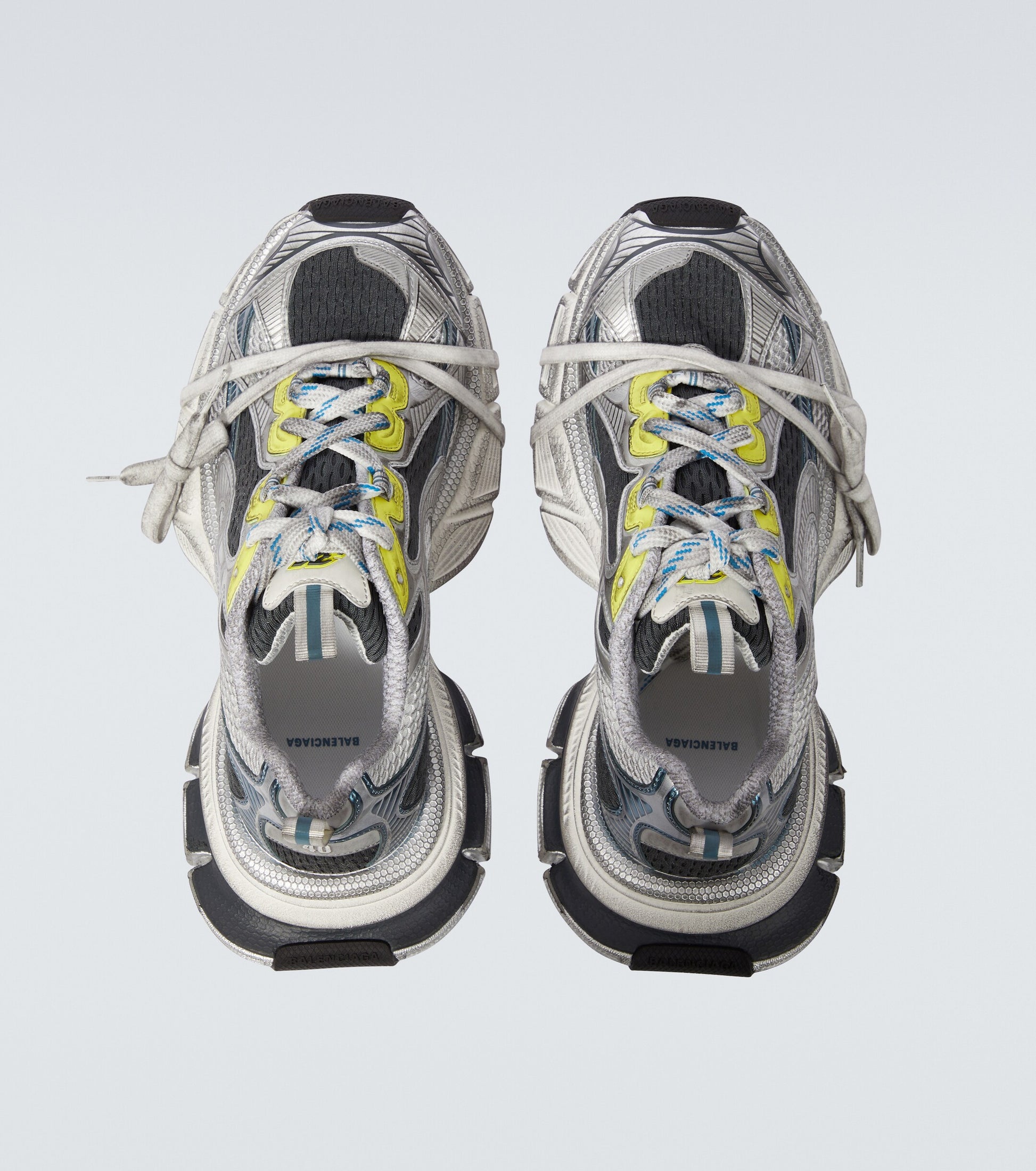white-black-blue-yellow 3XL oversized sneakers

chunky brutalist sneakers with mesh upper

trail running inspired tech footwear

balenciaga style extra large sneakers