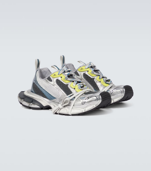 white-black-blue-yellow 3XL oversized sneakers

chunky brutalist sneakers with mesh upper

trail running inspired tech footwear

balenciaga style extra large sneakers