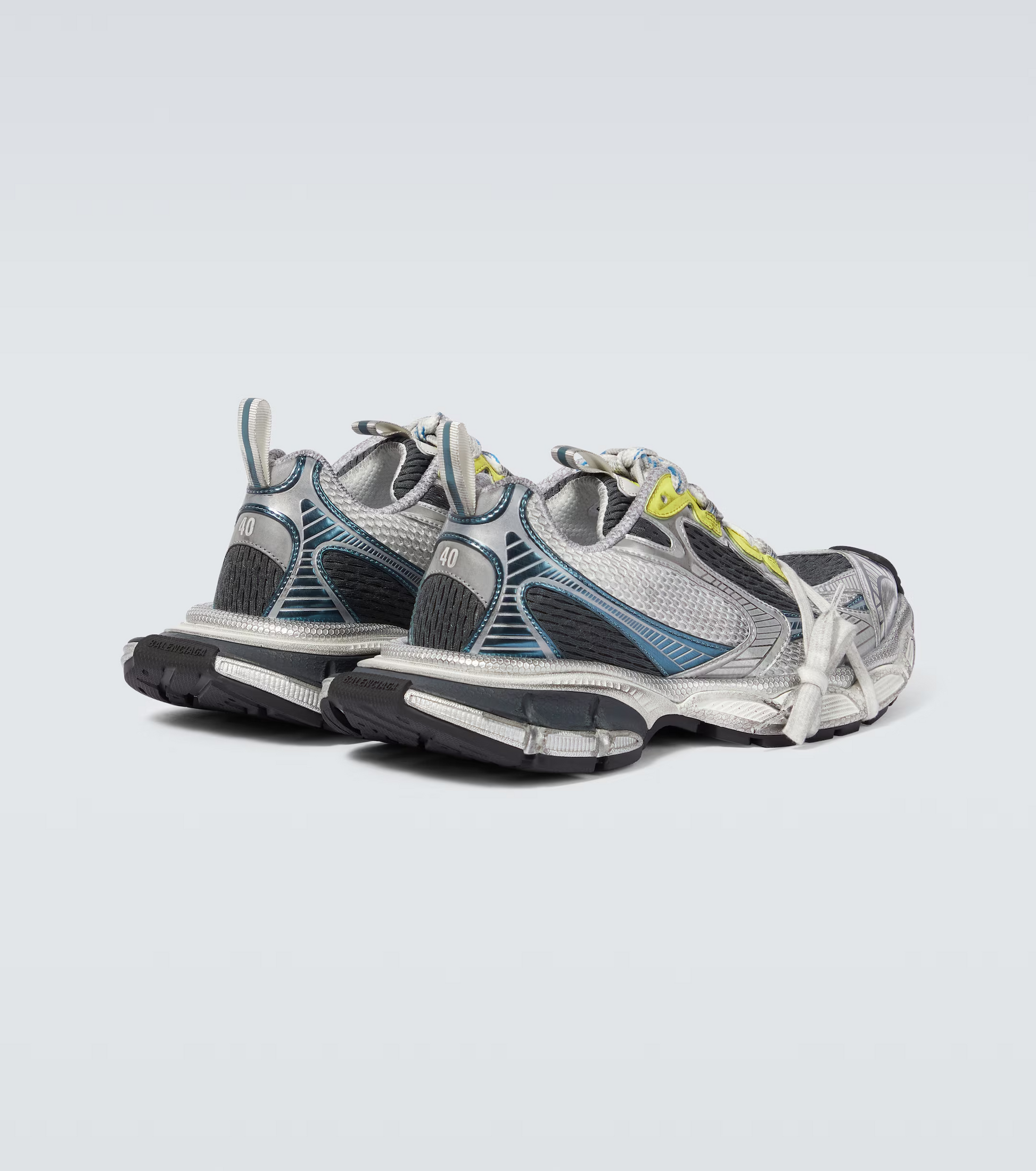 white-black-blue-yellow 3XL oversized sneakers

chunky brutalist sneakers with mesh upper

trail running inspired tech footwear

balenciaga style extra large sneakers