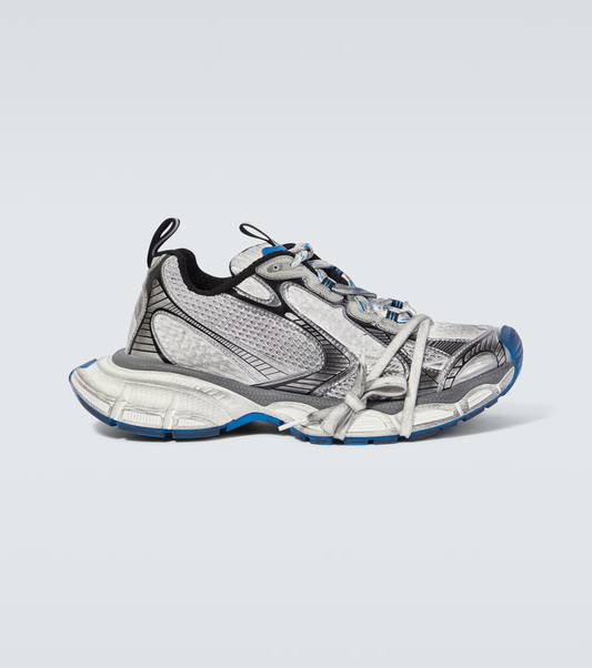 white-gray & blue 3XL oversized sneakers

chunky brutalist sneakers with mesh upper

trail running inspired tech footwear

balenciaga style extra large sneakers