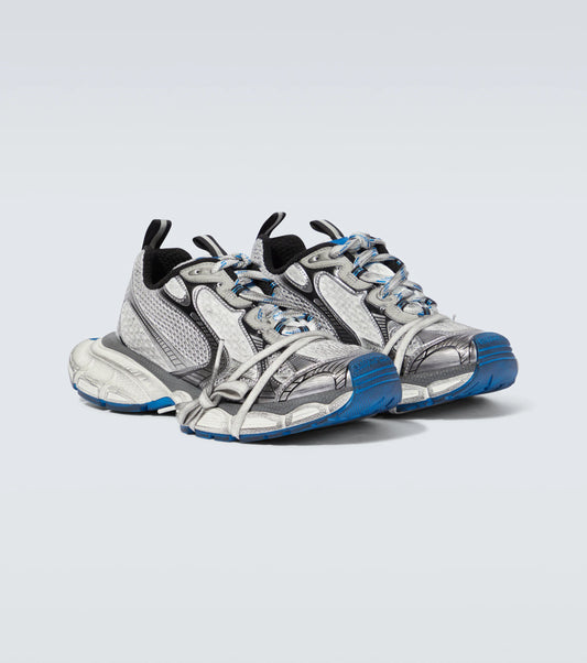 white-gray & blue 3XL oversized sneakers

chunky brutalist sneakers with mesh upper

trail running inspired tech footwear

balenciaga style extra large sneakers