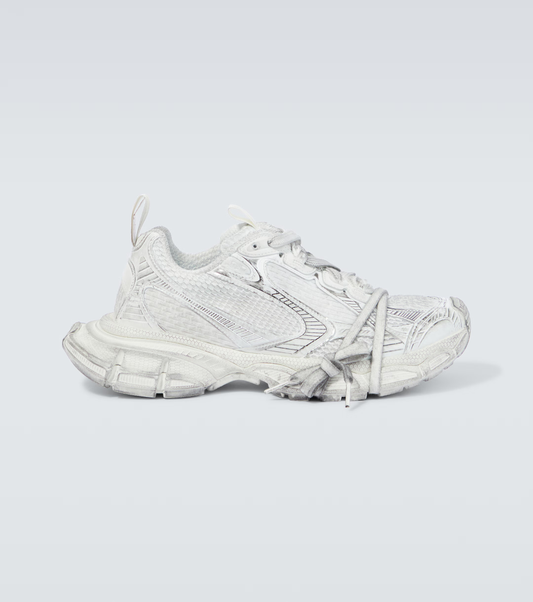 white grey 3XL oversized sneakers

chunky brutalist sneakers with mesh upper

trail running inspired tech footwear

balenciaga style extra large sneakers