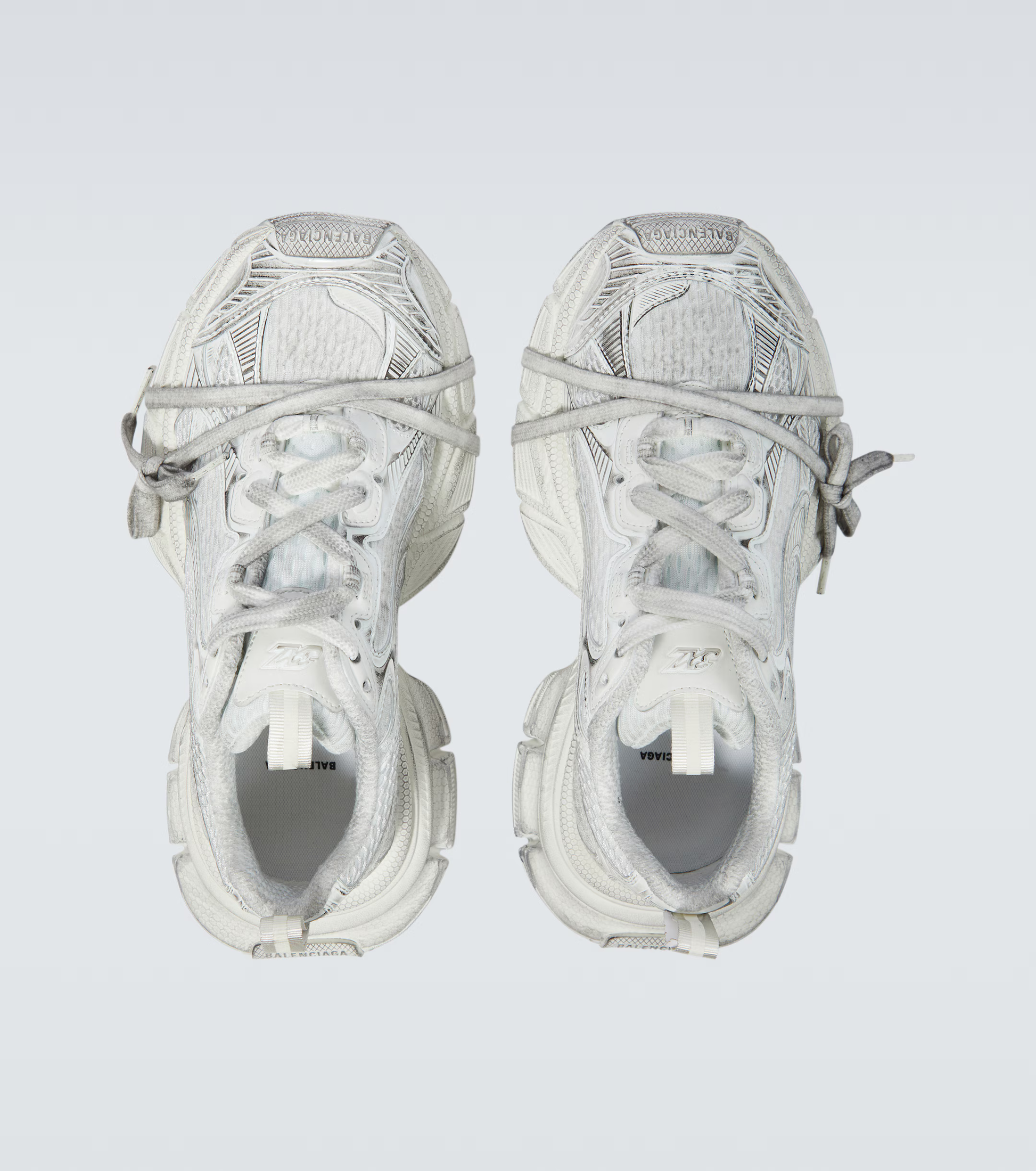 white grey 3XL oversized sneakers

chunky brutalist sneakers with mesh upper

trail running inspired tech footwear

balenciaga style extra large sneakers