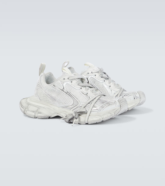 white grey 3XL oversized sneakers

chunky brutalist sneakers with mesh upper

trail running inspired tech footwear

balenciaga style extra large sneakers