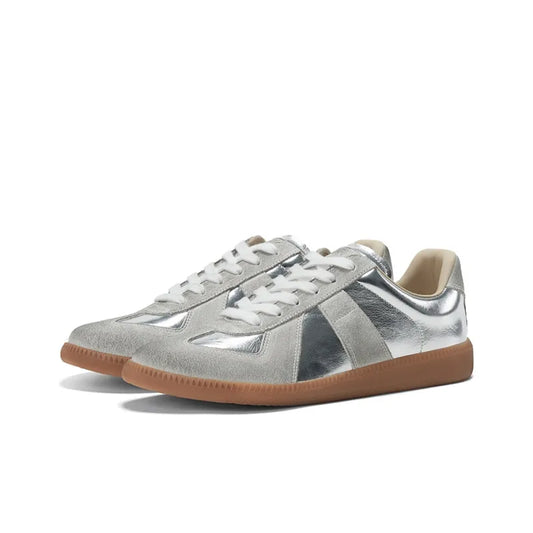 silvery german army trainers sneakers

retro maison margiela style shoes

luxury suede panelled trainers in silver

leather minimalist sneakers void packaging